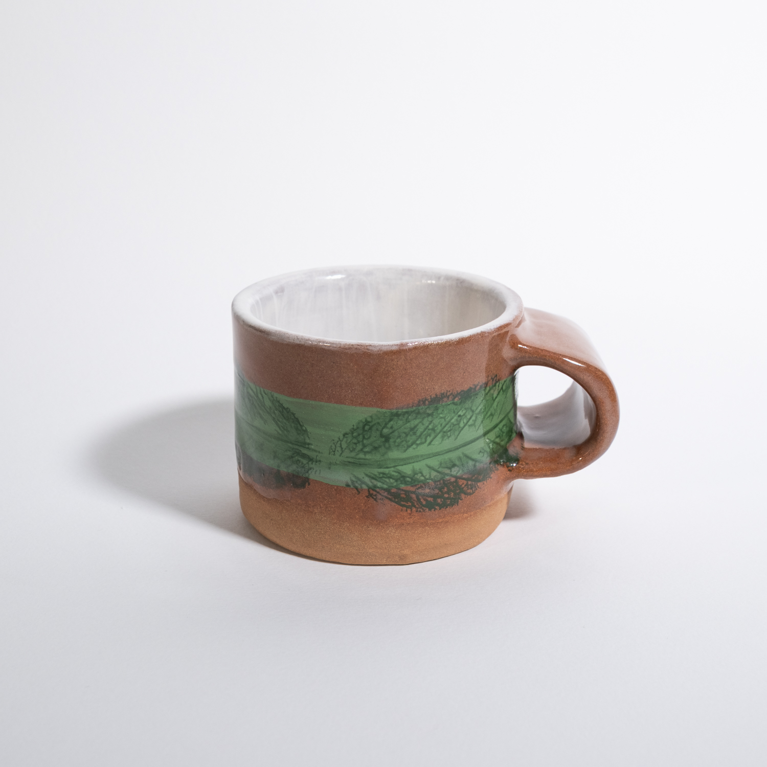 Tazza con decoro botanico